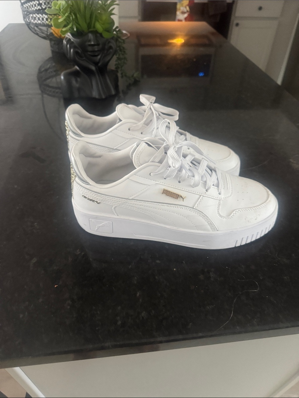 Puma Women’s White Sneakers with Gold Heel Accent